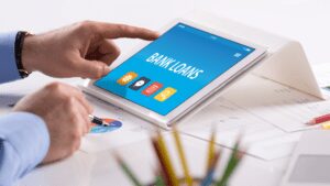 the words “bank loans” are on display on a tablet