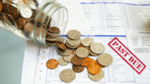 coin jar with money on past due medical bills