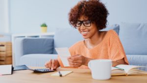 a person calculates figures on a calculator for personal installment loans