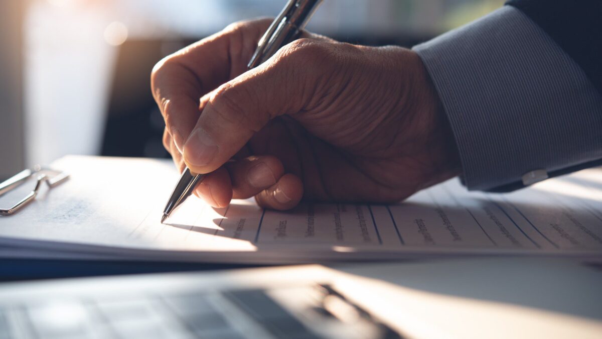 a person signs a loan contract