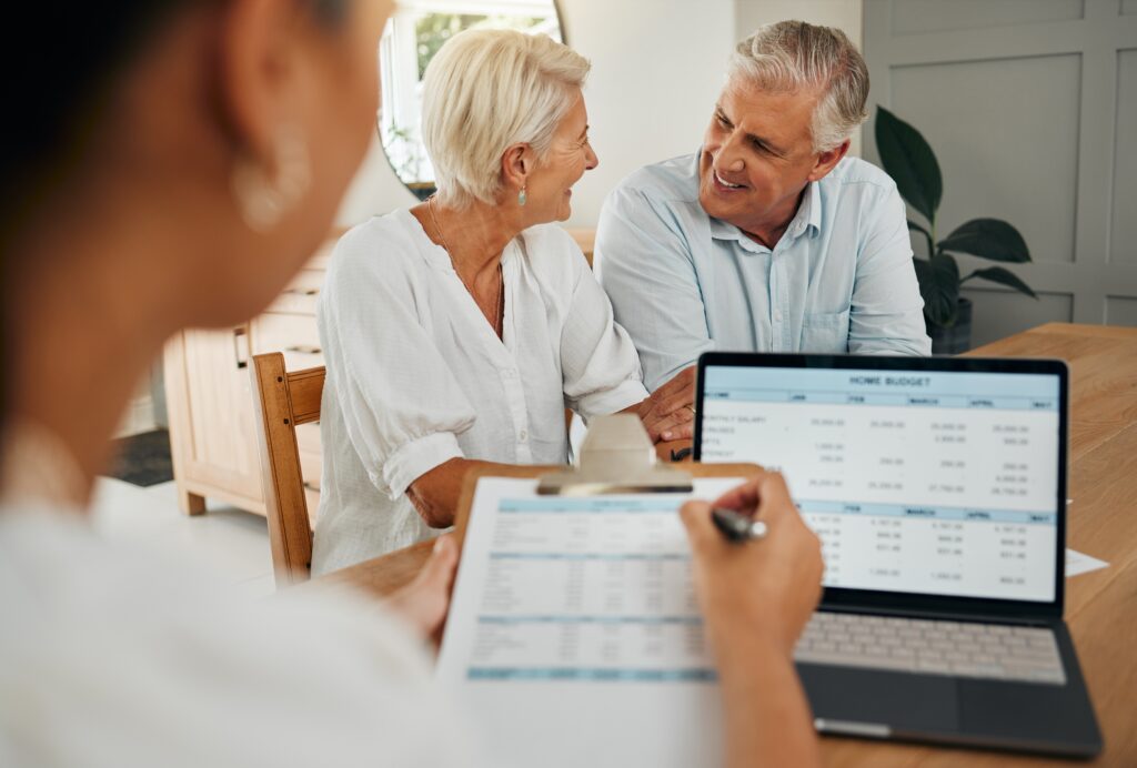 Elderly couple sits with advisor as they apply for funeral financing | Funeral financing options