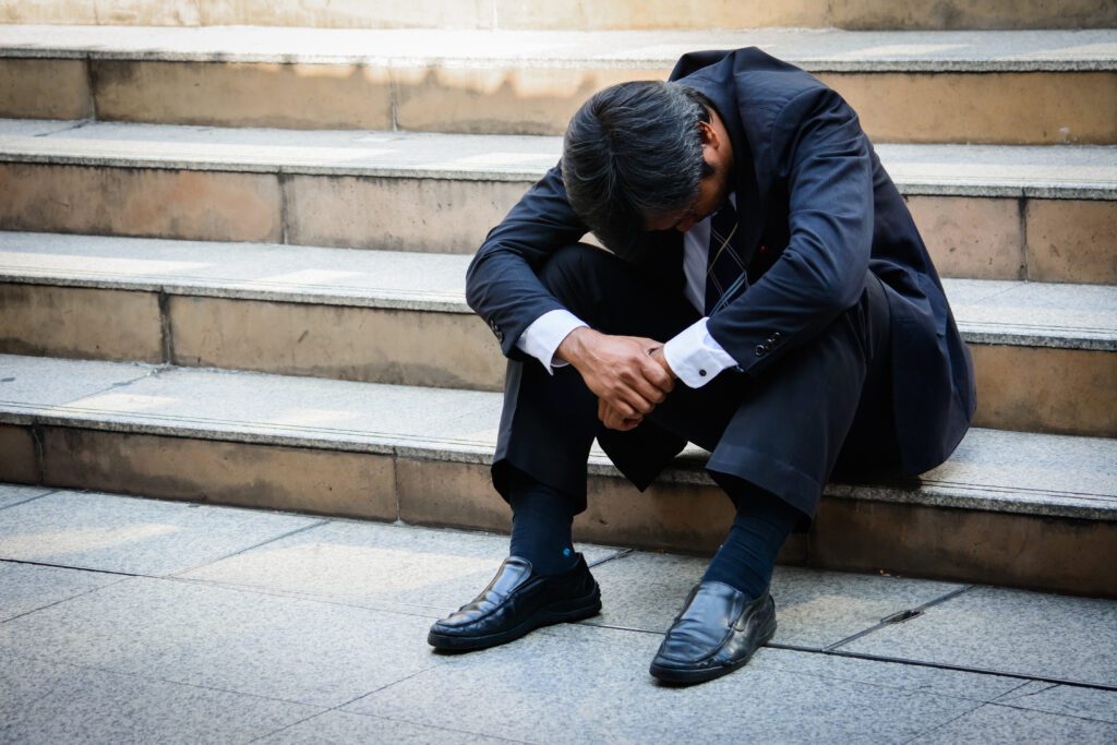 A stressed businessman who just lost his job | How do emergency loans work?
