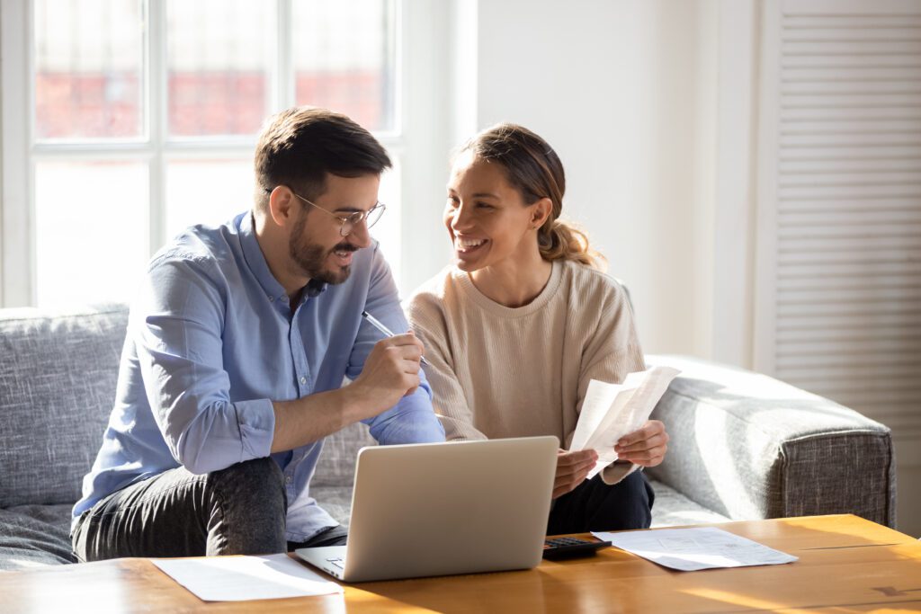 A young couple applying for a line of credit | How does a relocation loan work?