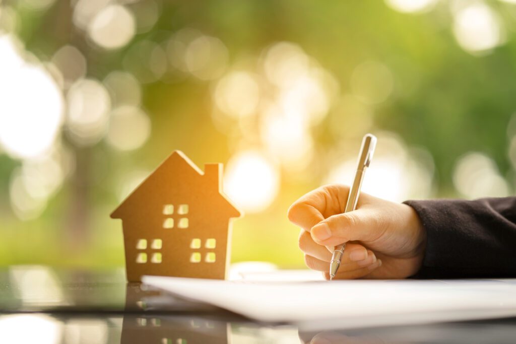 A woman signing an installment loan agreement | How does a relocation loan work?