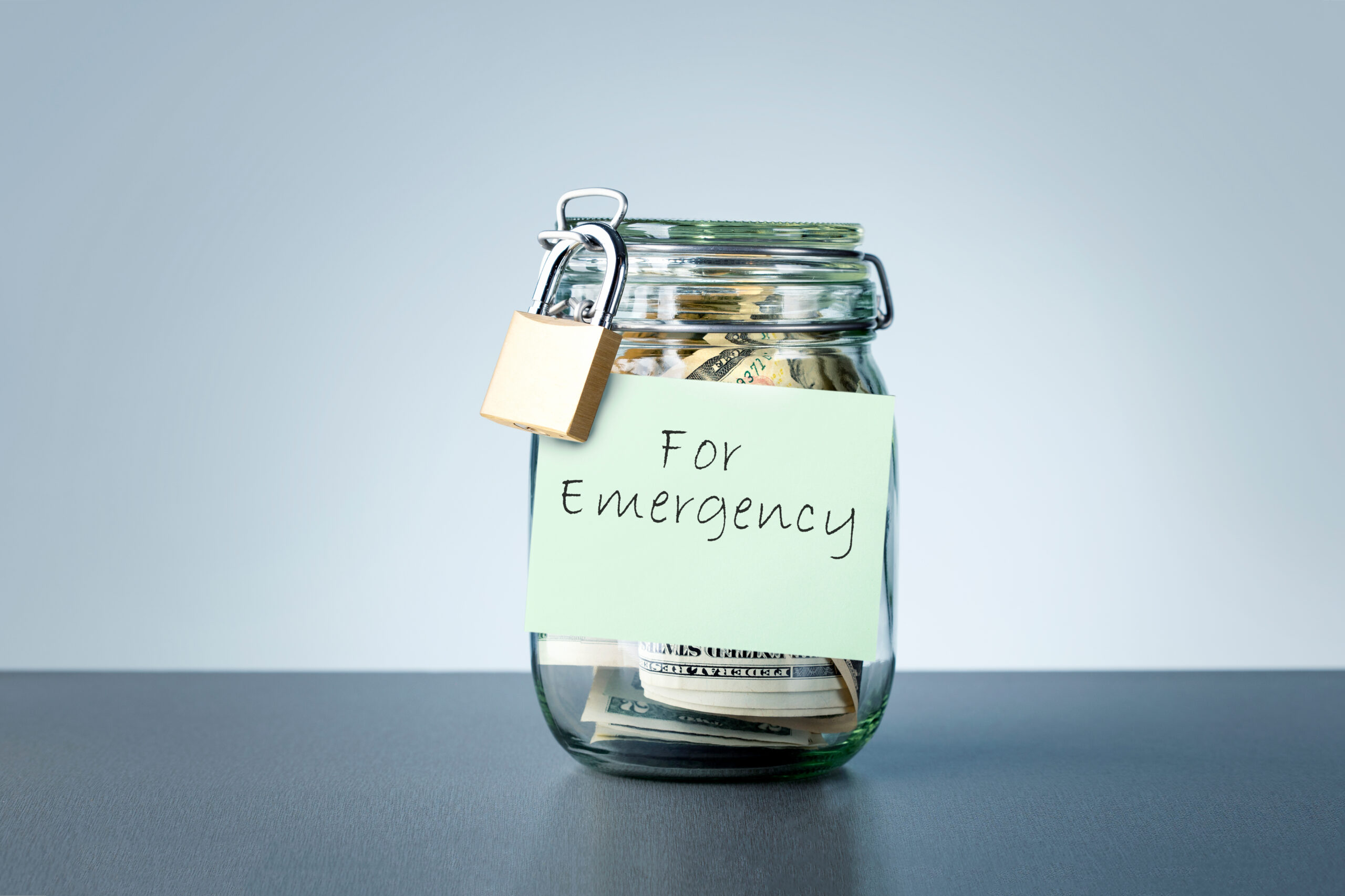Locked jar full of money labeled as "For Emergencies" | Ways to get emergency money