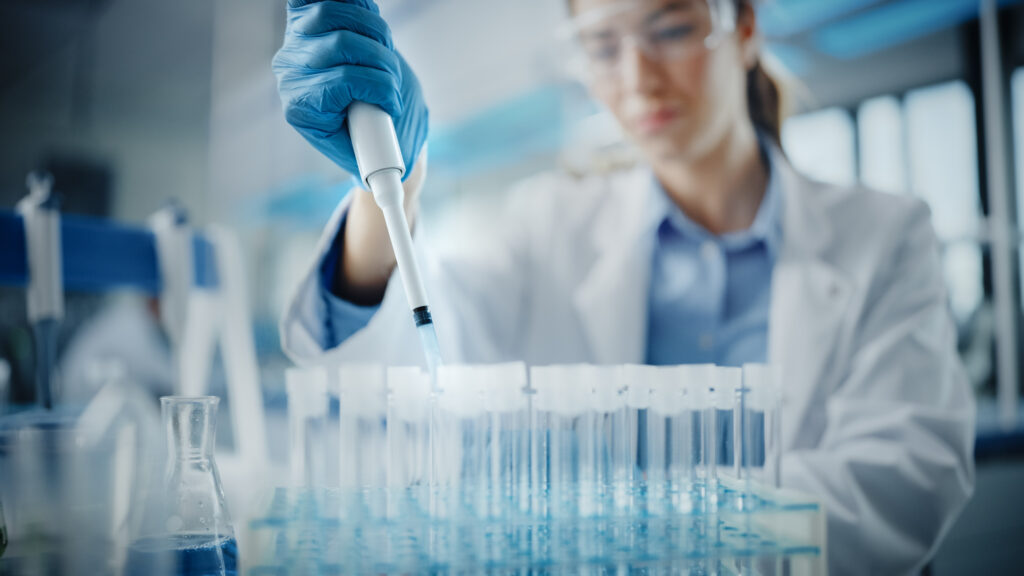 Research assistant uses dropper to put studies medicine inside vials in laboratory | Ways to get emergency money