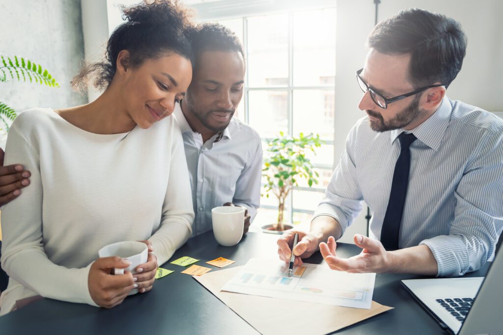 A couple working with a financial consultant | Loans like Upstart